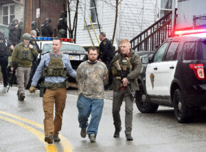 Stand-off gunman charged with sexual assault, having gun